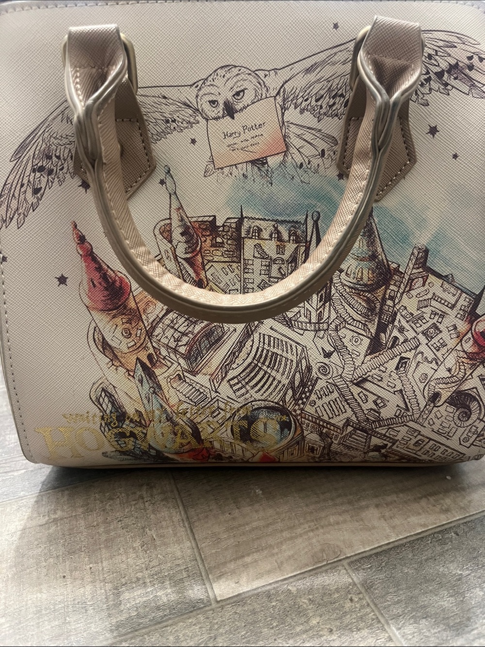 Warner Bros. Beige and Gold Illustrated Dome Satchel with Muted Accent Colors